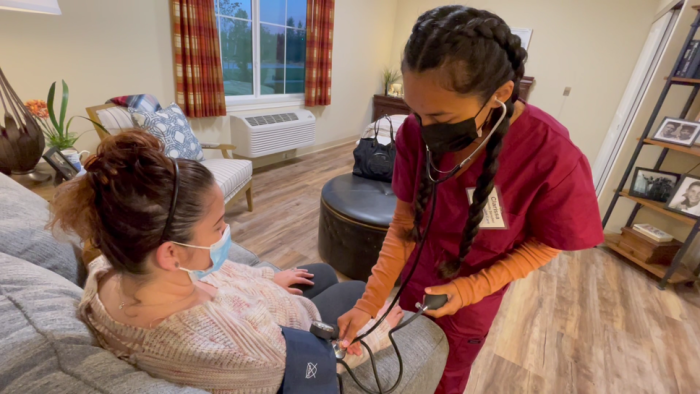 Medical professional takes a patient's blood pressure